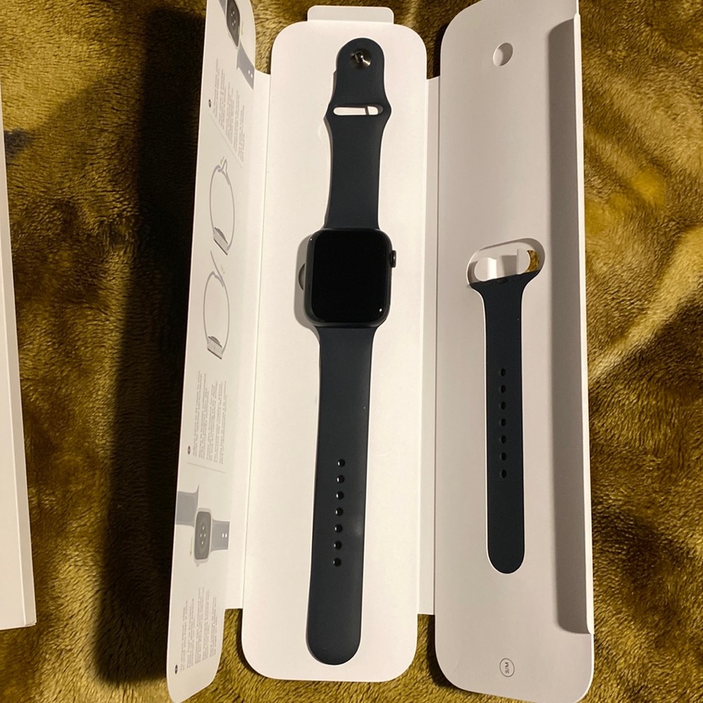 Barely used series 5 Apple Watch all black 44 inch screen with apple care.